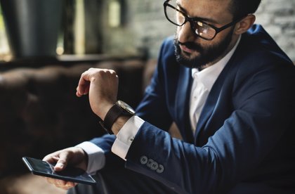 Man checking notifications on smart watch